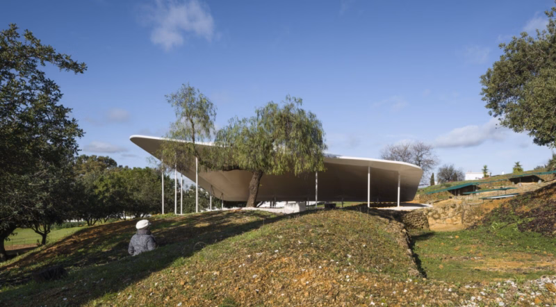 The textile canopy of the Postumio tombs integrated into the wooded landscape of the Carmona Necropolis. Nd_Arquitectos. Spain. Photo by Jesús Granada.